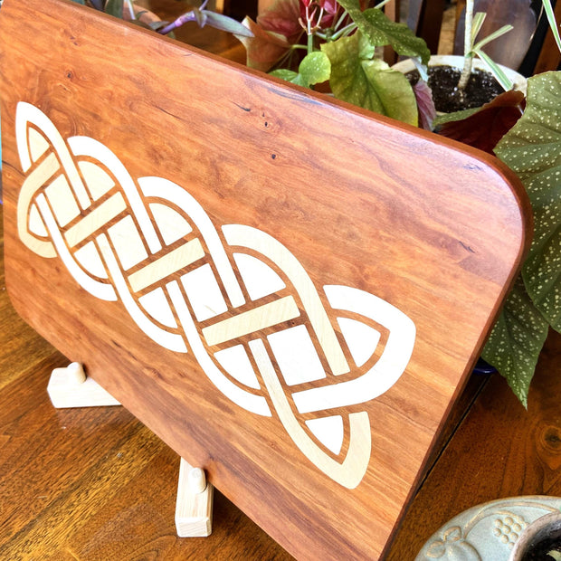 Cherry charcuterie board - complex Celtic knot inlay.