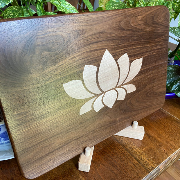 Stunning Walnut charcuterie board with Lotus Flower inlay made from soft Maple.