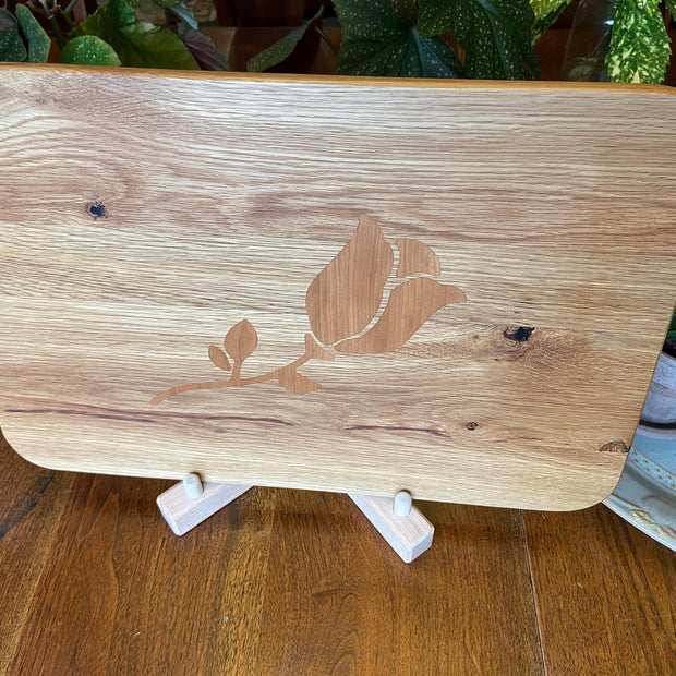 White Oak charcuterie board with subtle rose and stem inlay made from Cherry.